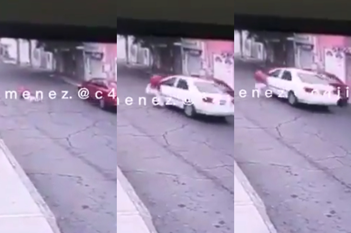 A woman tries to flee and does not mind dragging a woman with her car