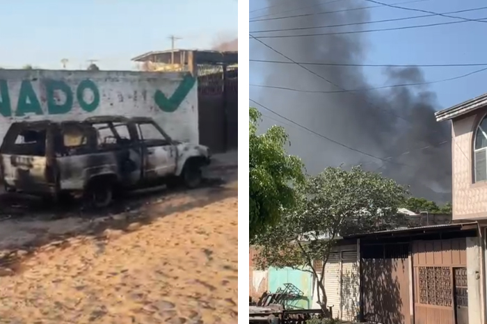 Vehículo incendiado obstruyendo el paso en una carretera de la Tierra Caliente de Michoacán.