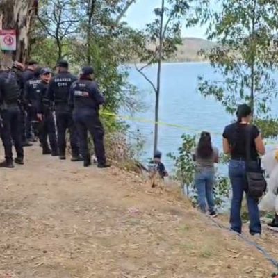 Peritos de la Fiscalía General del Estado realizan diligencias en la presa de Cointzio por hallazgo de cadáver.