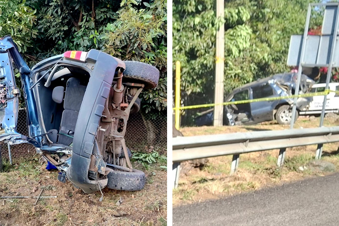 Equipos de rescate y bomberos trabajando en la volcadura de una camioneta azul en la carretera Uruapan-Paracho.
