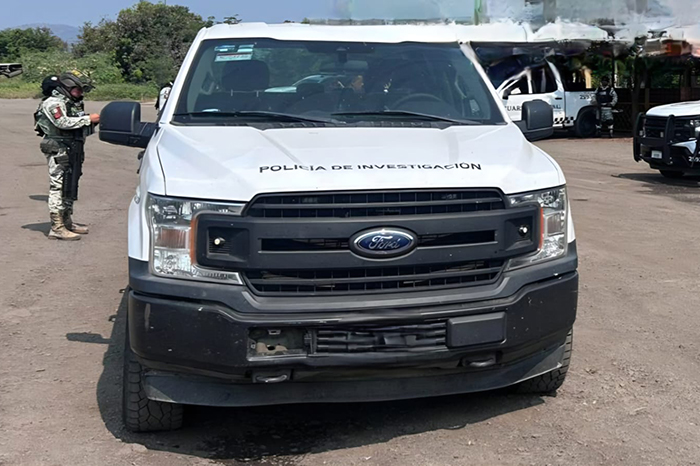 Elementos de la Fiscalía de Michoacán y la Guardia Nacional resguardan el predio El Estanque de Ambriz en Apatzingán.