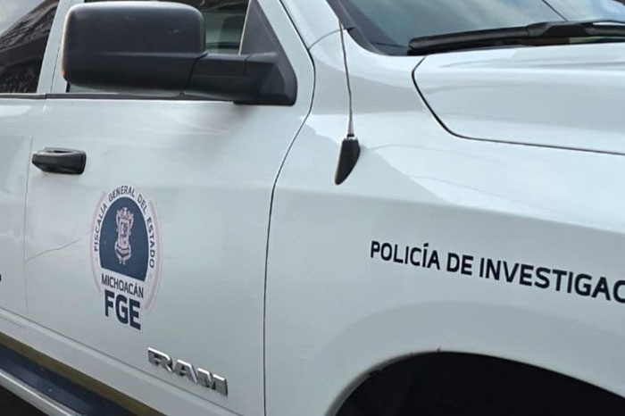 Elementos de Seguridad Pública y la Fiscalía Regional resguardando el Fraccionamiento Torre Ceiba en Uruapan.